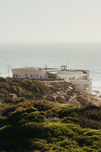 Photography of Building Beside Seashore