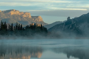 Photography of Calm Body of Water and Mountains