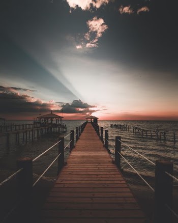 photography of dock during sunset