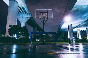 photography of empty wet basketball court