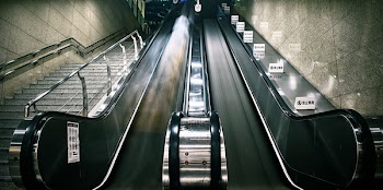 Photography of Escalator and Stairs
