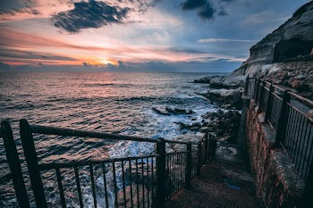 Photography of Grey Rocks Beside Sea