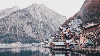 photography of house beside body of water