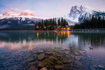 Photography of Lake Beside Mountain and Pine Trees