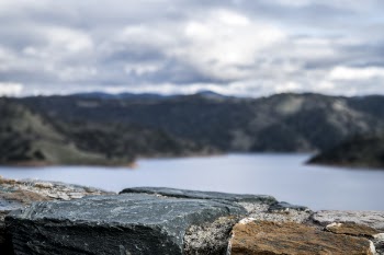 Photography of Lake Between Mountain at Daytime