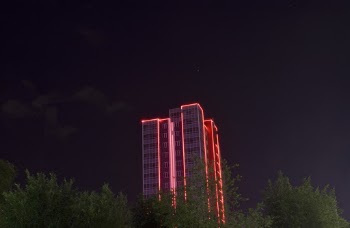 Photography of Lighted High-rise Building during Night Time