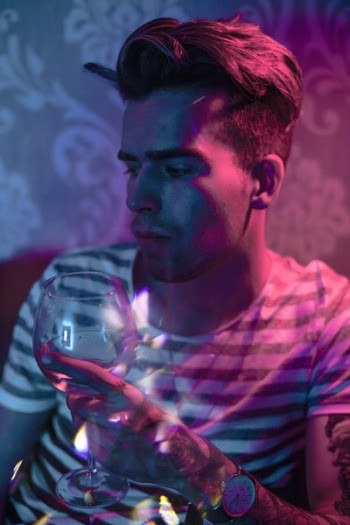 Photography of Man Holding Wine Glass
