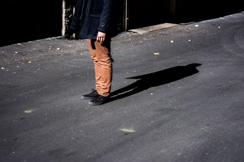 photography of man wearing coat