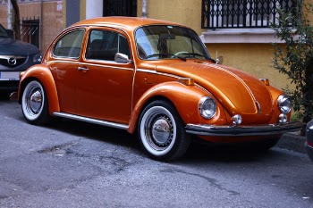 Photography of Orange Volkswagen Beetle