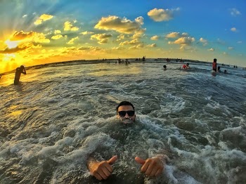 Photography of People on Ocean During Dawn