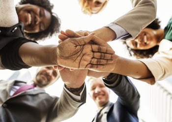Photography of People Stacking Hands Together