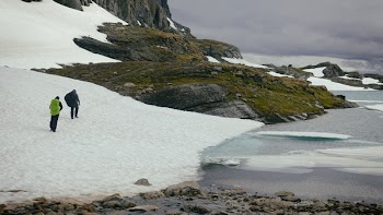Photography of People Walking Near Body of Water