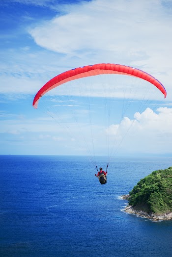 Photography of Person Doing Parachute