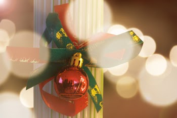 Photography Of Red Bauble With Green Ribbon