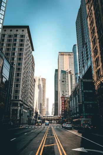 photography of road besides buildings during daytime