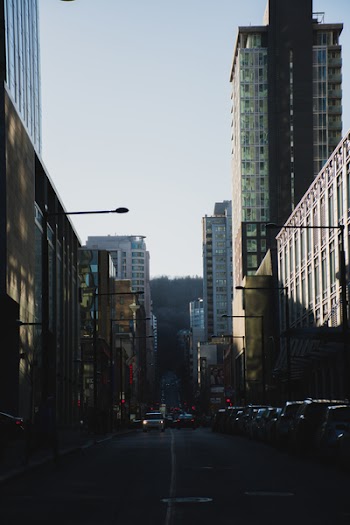 Photography of Roadway in Between Buildings