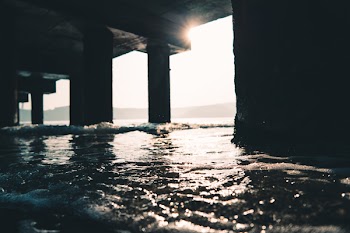 Photography of Sea Water Under The Dock
