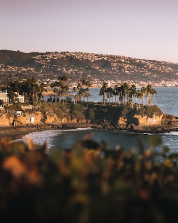 Photography of Seashore and Mountain Range