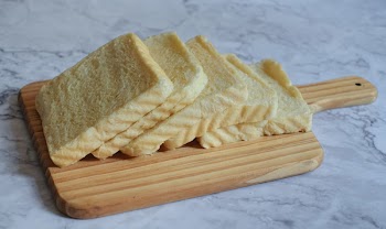 Photography of Sliced Bread on Chopping Board