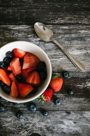 Photography of Strawberries And Blueberries On Bowl