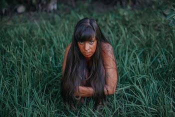 Photography of Topless Woman Lying on Green Grass