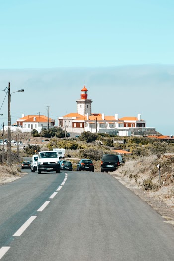 Photography of Vehicle Traveling on Road