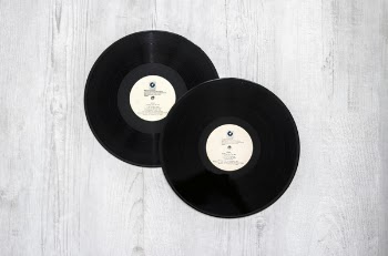 Photography of Vinyl Records On Wooden Surace