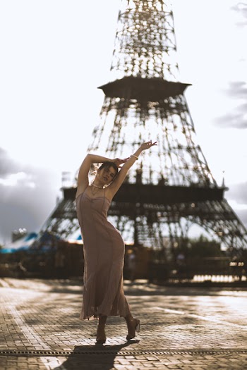 Photography Of Woman Near Tower