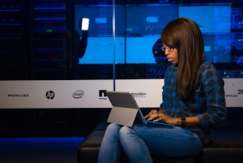 Photography of Woman Using Ipad