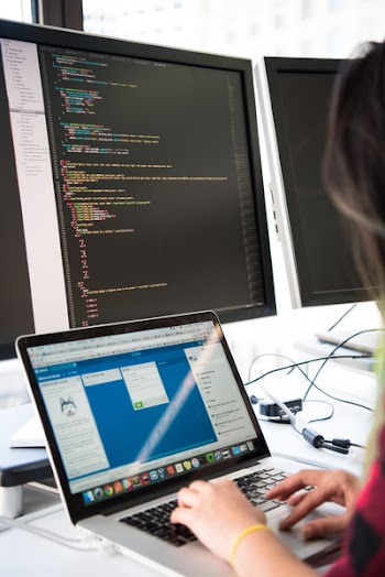 Photography of Woman Using Laptop