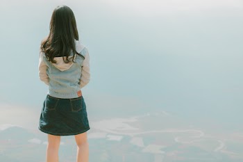 Photography of Woman Wearing Hooded Jean Jacket