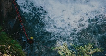 Photon of Man on Water Attached by Roof