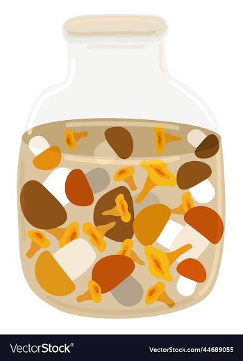 pickled mushrooms in a glass jar isolated