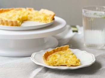 Pie on White Sauce Beside Drinking Glass