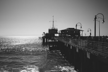 Pier Bustling With People On A Sunny Day