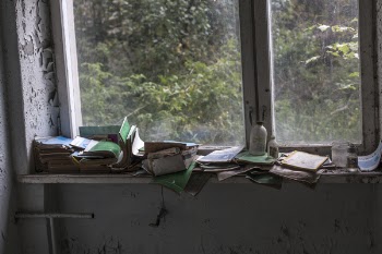 Pile of Books Beside Sash Window