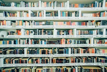 pile of books on shelf