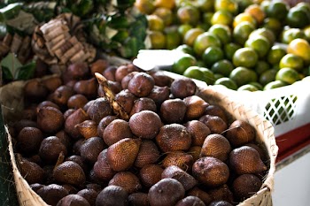 Pile of Brown Fruit With Brown Basket