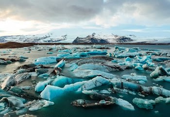 pile of ices on body of water