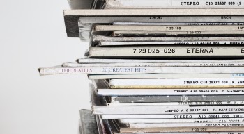 Piled Vinyl Records With White Background