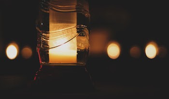 Pillar Candle Inside Glass Bottle