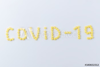 Pills for COVID-19 on a white background
