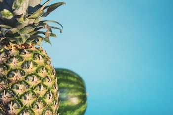 pineapple with watermelon on the background