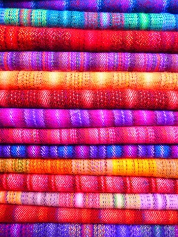 Pink and Blue Textile Near Yellow Textile