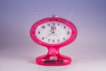 Pink and White Mp3 Analog Clock Displaying at 12:00