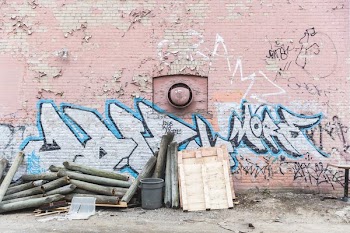 Pink Brick Wall Back Alley Wood Pile