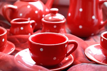 Pink Ceramic Coffee Mugs Beside Tea Pot