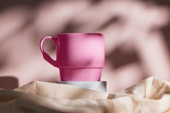 Pink Ceramic Mug on Brown Textile · Free Stock Photo