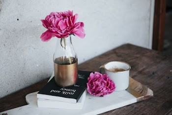 pink petaled flower on bottle