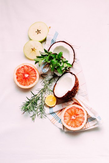 Pinkish Instagram shot of coconut and other fruits 